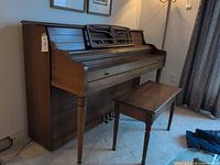 Front and side view of Williams studio piano with bench