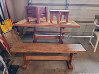 picnic table with benches, planter on tabletop, stool on tabletop