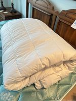 Comforter folded on bed showing overall appearance