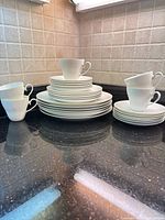 Full set stacked showing plates and cups