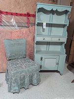 Cabinet and chair together showing overall appearance