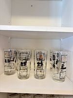 Full set of eight glasses on shelf