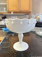 Full view of white milk glass pedestal compote showing Teardrop pattern