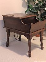 Front angle showing flip-top compartment and overall form