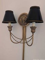 Full view showing double-arm sconce with shades