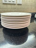 Stack of bowls showing side profile and textured rim