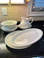 Group shot showing all white serving pieces together