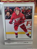 Front of Dylan Larkin Glossy Rookies card in sleeve