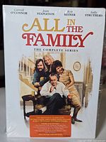 Front of boxed set showing title graphics and principal cast image