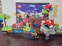 Full assembled set with figures, rings, Chaos Emeralds and instruction booklet displayed