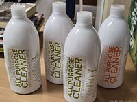 Four Sapadilla All Purpose Cleaner bottles on table