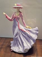 Front view of Royal Doulton Julie HN5153 figurine showing full outfit and pose
