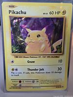 Front of sleeved Pikachu cracked-ice holo card