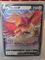 Front view of Ho-Oh V card showing artwork, stats and foil finish