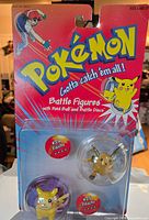 Front view showing sealed Pokémon Battle Figures packaging with Pikachu & Raichu