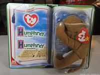 Front of sealed Ty Humphrey the Camel packaging showing toy in blister and Legends graphics
