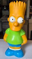 Front view of Bart Simpson plastic coin bank
