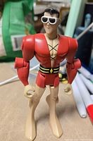 Front view of Plastic Man figure standing