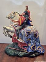 Left profile of porcelain knight on rearing horse