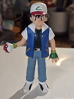 Front view of Ash Ketchum figure with Pokéball