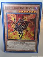 Front of sleeved Red-Eyes Black Flare Dragon card