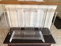 All three acrylic pedestal stands and two risers displayed together