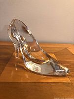 Left side view of clear crystal slipper
