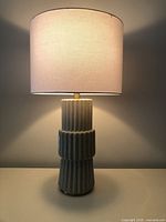 Entire lamp illuminated showing shade and base