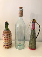 All three decorative bottles side by side