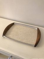 Top view of rectangular Picquot Ware tray showing wood ends, aluminum sides, laminate surface