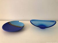 Glass bowl and pottery plate side by side