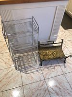 Overall view of both items—chrome shelf and metal log holder