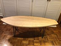 Top view of maple surfboard coffee table showing shape and hairpin legs