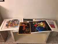 Overall lot showing all loose prints and sealed IKEA sets on table