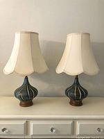 Front view of both matching table lamps on dresser