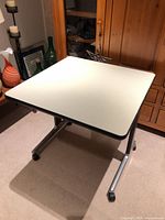 Full view of square table showing top surface and base