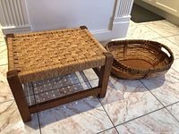 Ottoman stool and wicker basket side by side