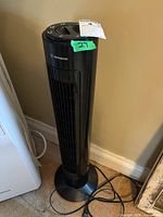 Full view of black tower fan standing on floor