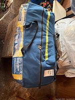 Blue Broadstone tent carry bag with label and zipper