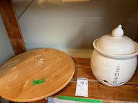 Wooden turntable and ceramic jar side by side