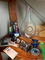 Group shot of all items including decanter, corkscrew, pump set, pour spout, boxed accessories