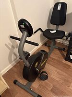 Full view of Marcy stationary bike showing seat, backrest, frame and pedals