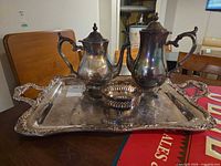 Full view of tray with coffee pot, teapot and open bowl displayed
