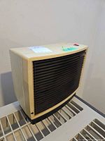 Front and side view of beige Thermaflo heater on rack