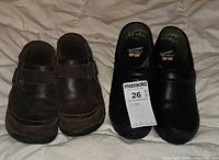 Both pairs of clogs side by side showing overall condition and size tag