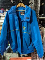 Front view of blue Sun Ice Calgary ’88 Olympic jacket on hanger