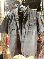 Full front view of short-sleeve Harley-Davidson shirt on hanger