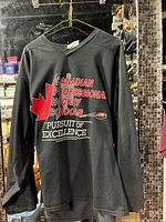 Front view of black mesh jersey hanging, showing full graphic and overall condition