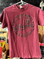 Full view of front of burgundy Leatherface Texas Barbecue T-shirt