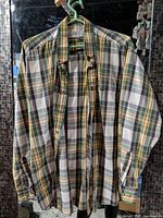 Full view of plaid flannel shirt hanging